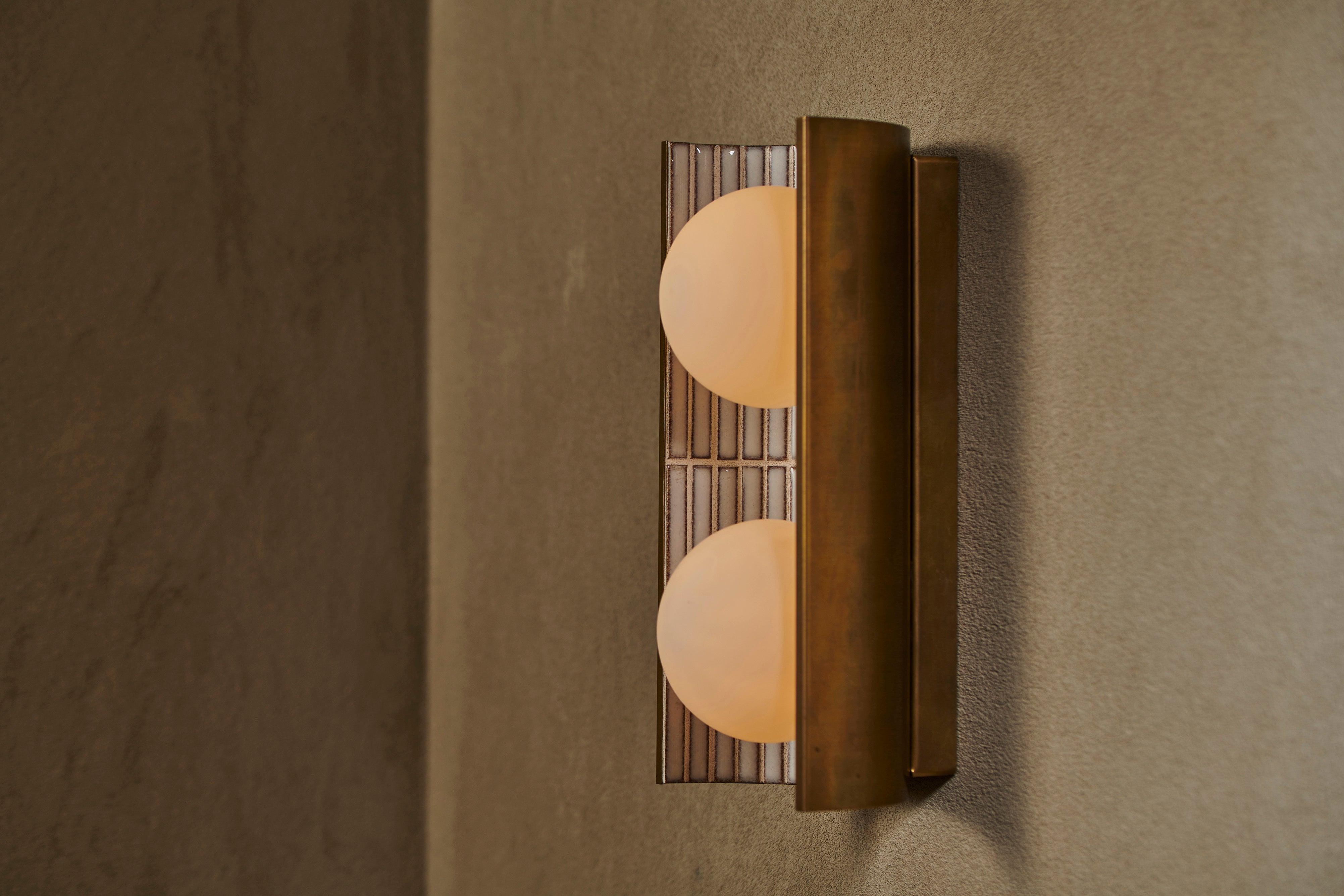 Handcrafted ceramic wall light by Transmitt. Mid-Century Inspired, Aged Brass. Made in Australia.