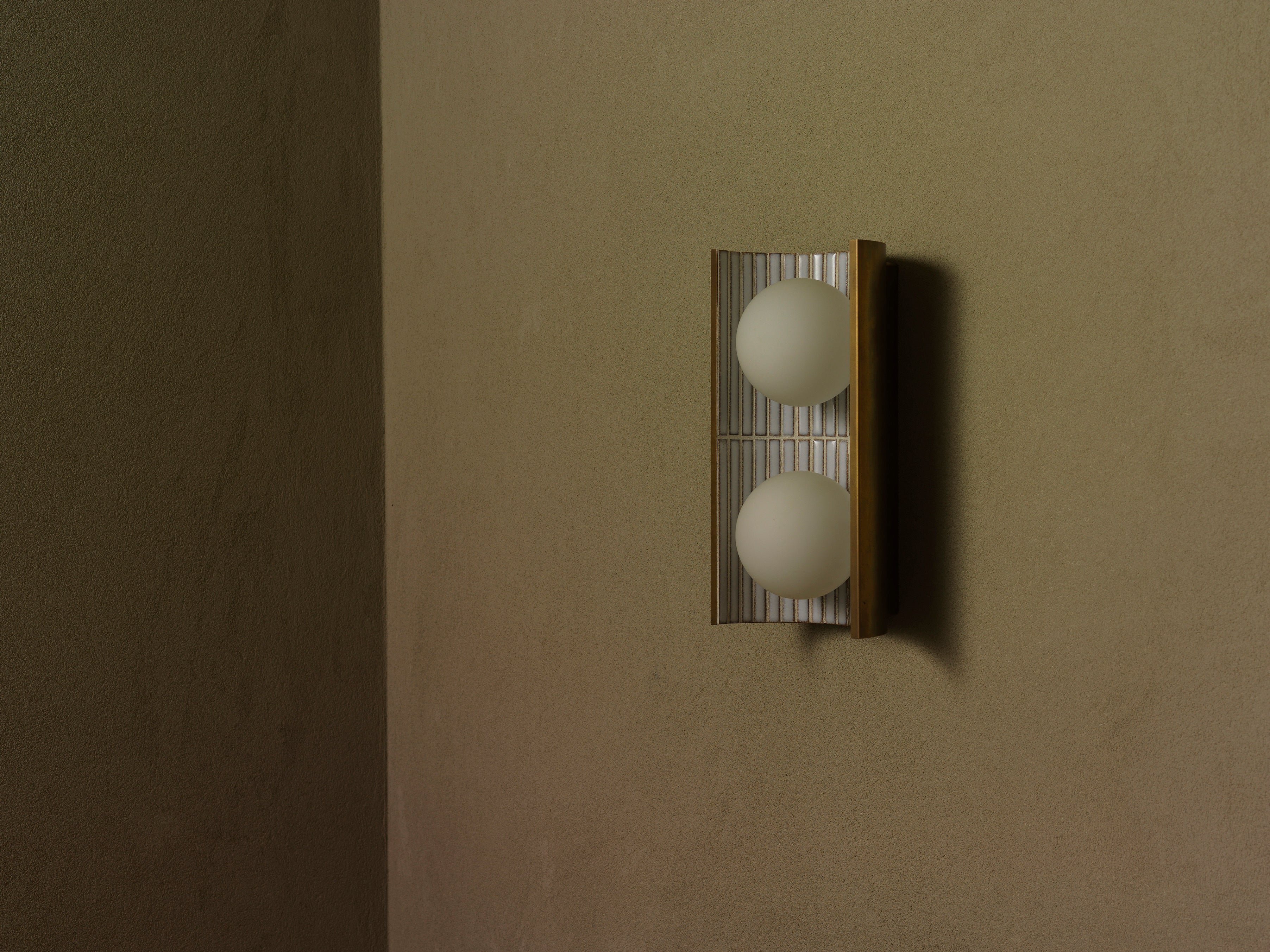 Handcrafted ceramic wall light by Transmitt. Mid-Century Inspired, Aged Brass. Made in Australia.