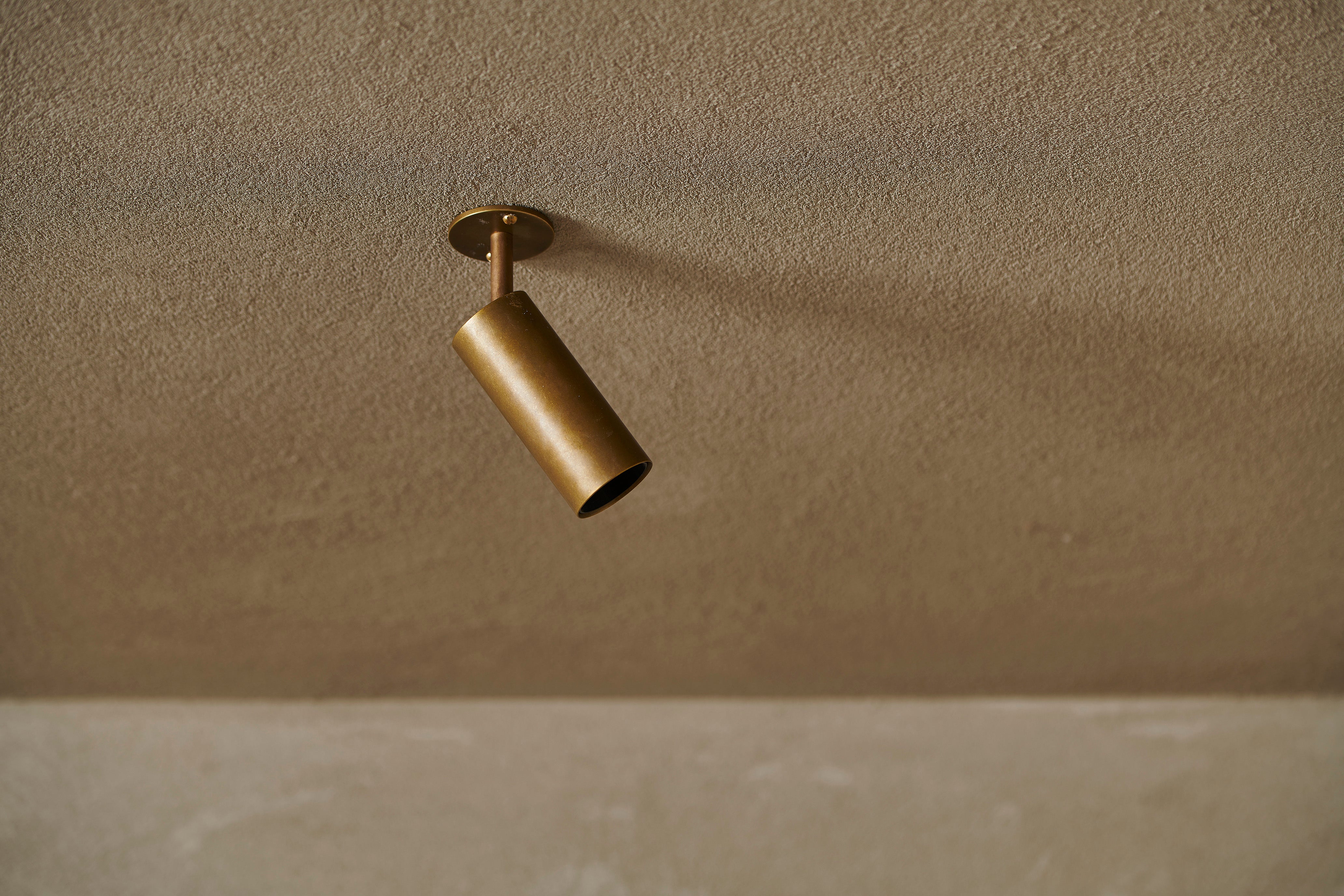 Handcrafted mini adjustable spot by Transmitt. Aged brass. Mid-Century Inspired. Made in Australia.