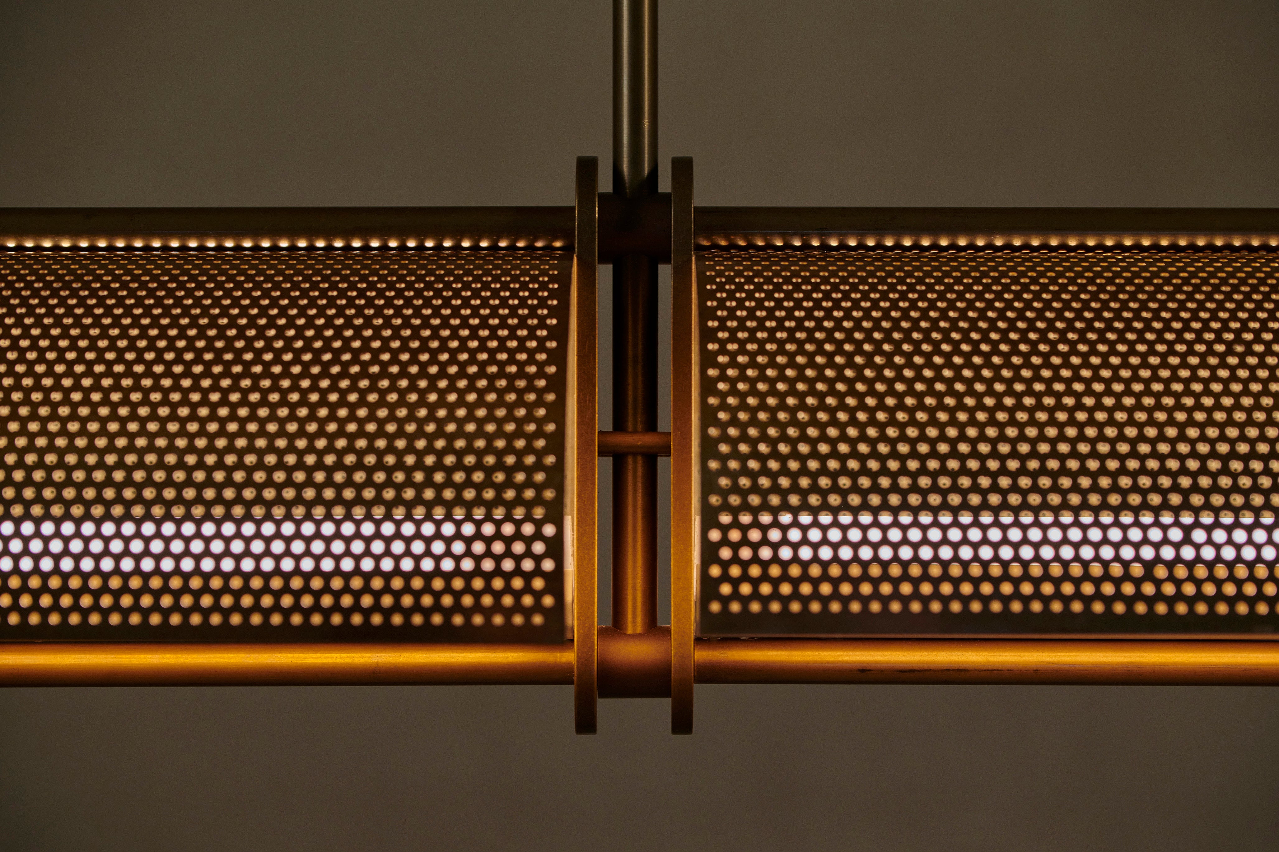 Handcrafted brass linear pendant by Transmitt. Made in Australia.