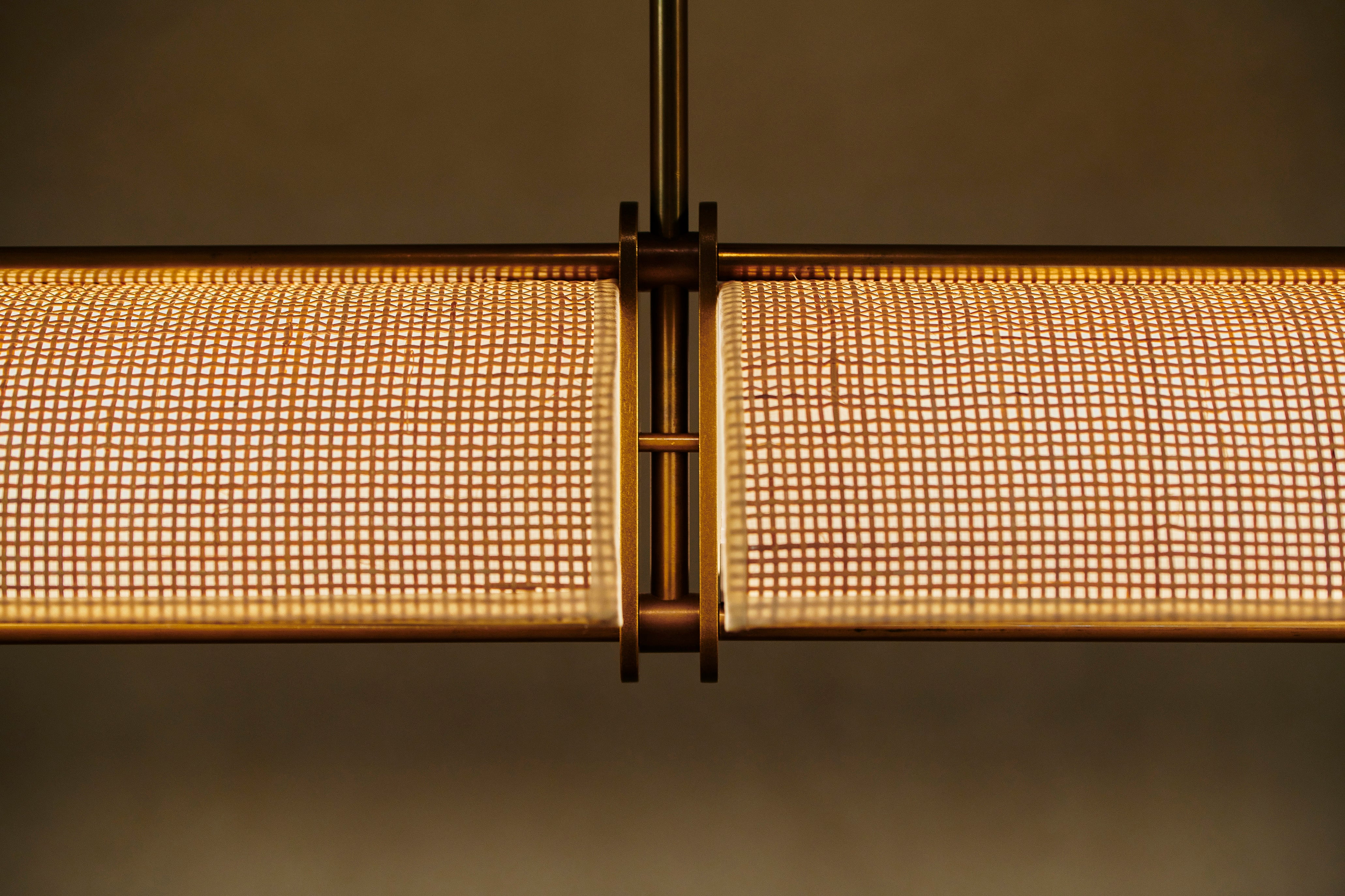 Handcrafted rattan linear pendant by Transmitt. Made in Australia.