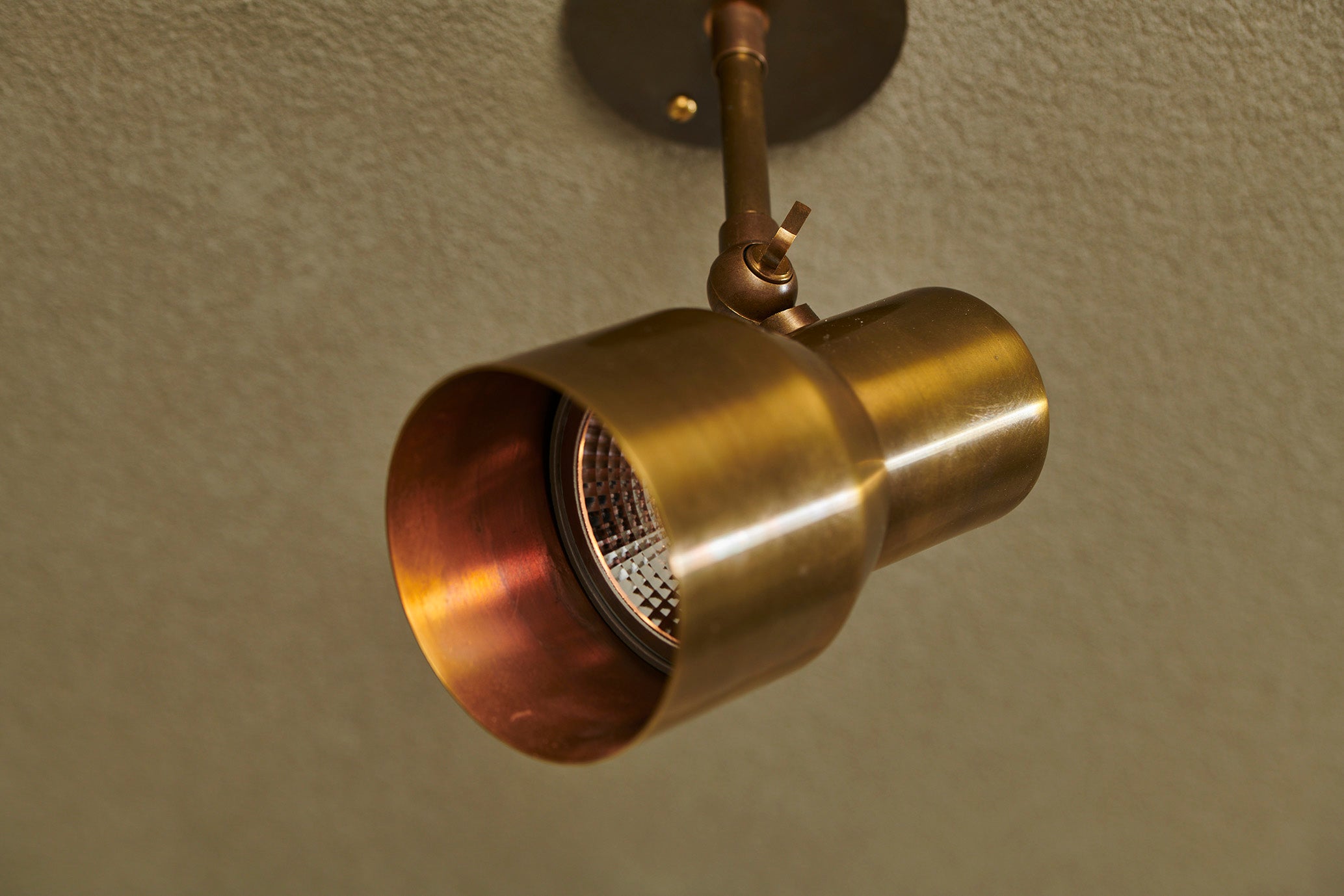 Handcrafted adjustable spot by Transmitt. Aged Brass. Mid-Century Inspired. Made in Australia.
